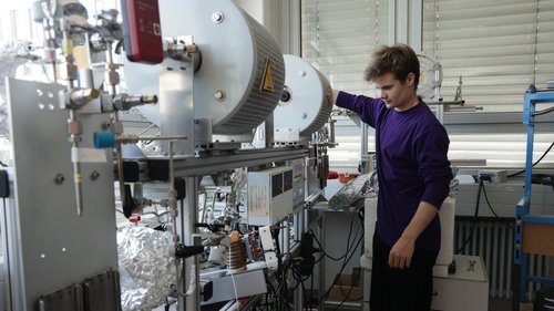 Linus Langenbacher, an undergraduate student in physics and glaciology at the Institute of Environmental Physics (IUP) at the University of Heidelberg, prepares a machine that will extract argon gas from a sample of ice at the IUP on May 23, 2024 in Heidelberg, Germany.